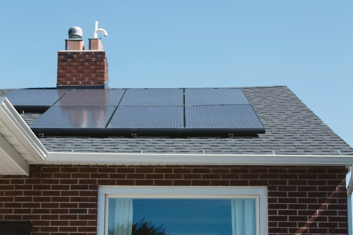 Brick home with solar panels on the roof